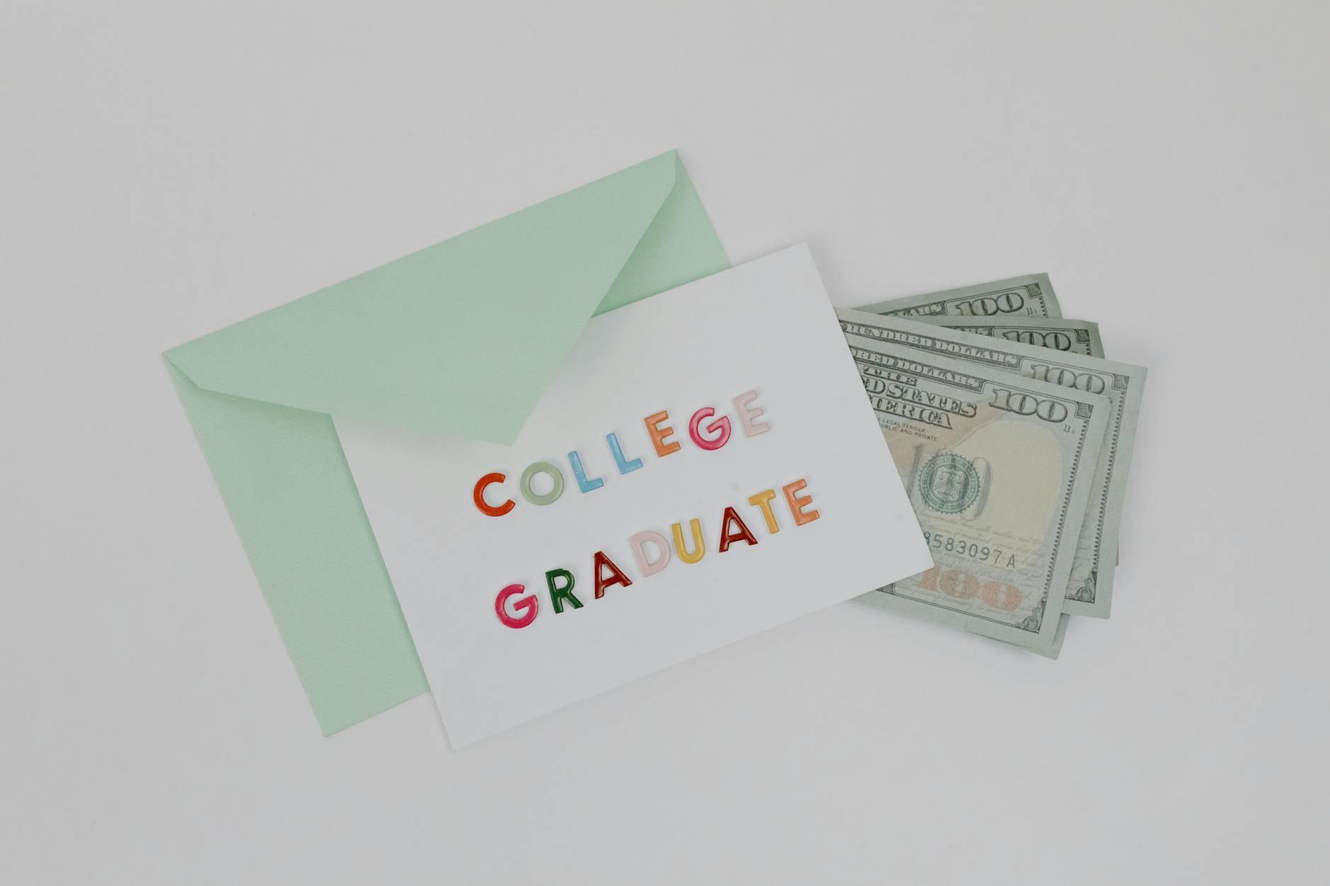 white greeting card with dollar bills