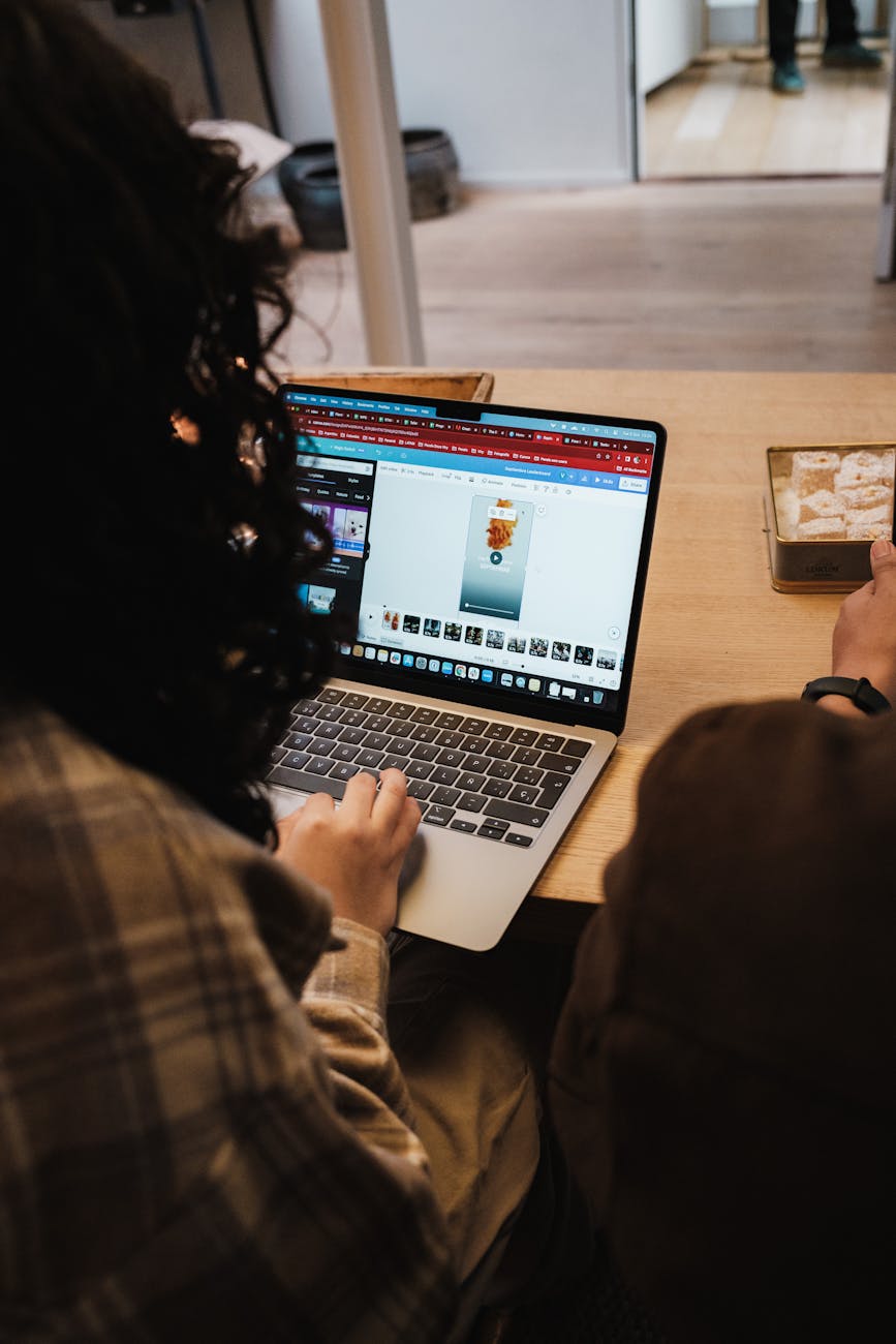 back view of woman working on laptop