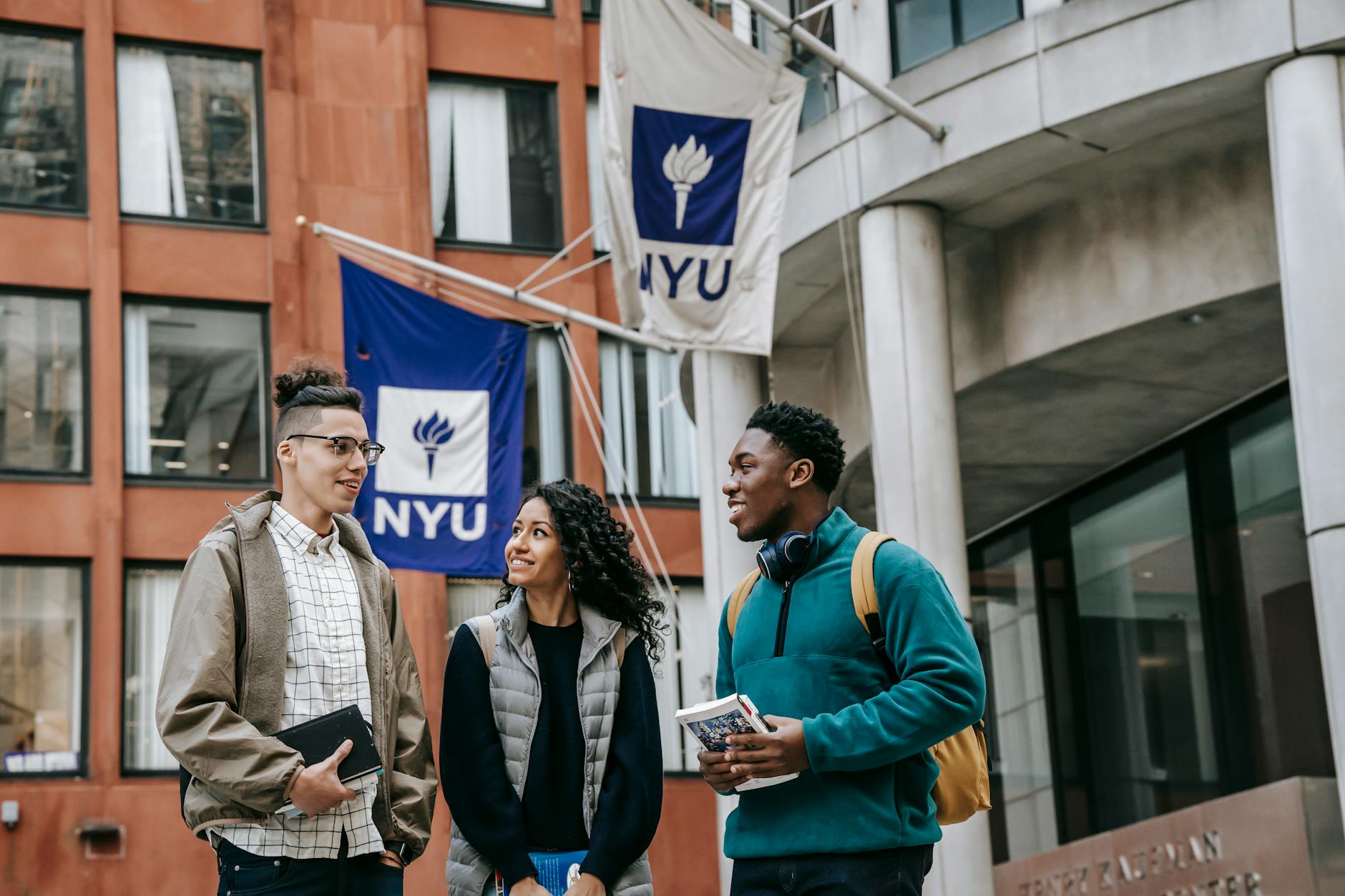 students standing near a building