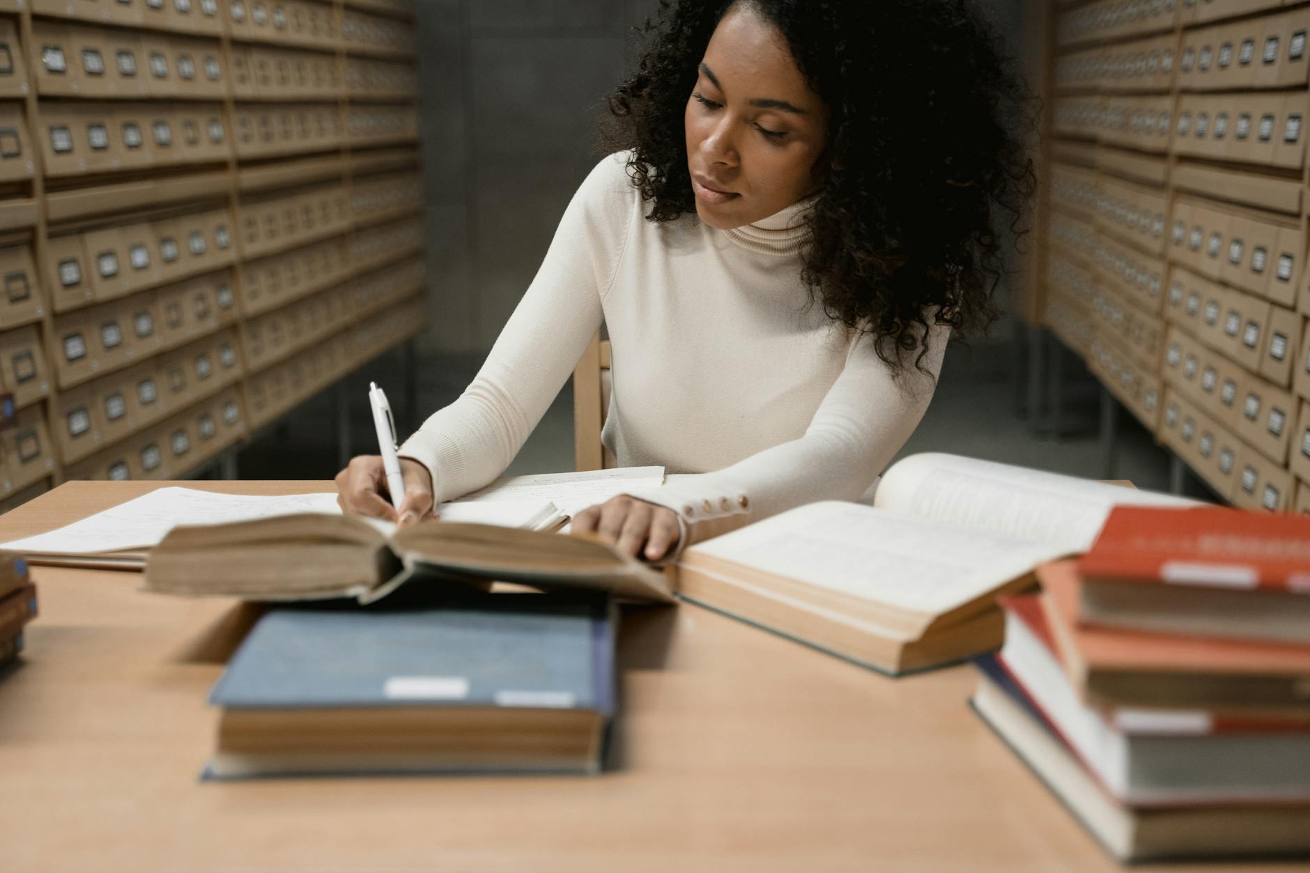 a woman researching in the library